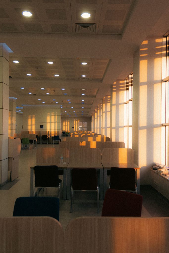 Sunlit conference room with tables and chairs